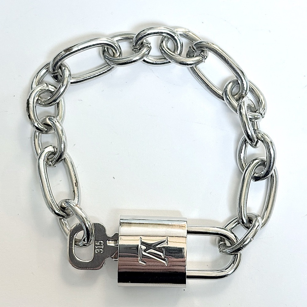 Silver Authentic Louis Vuitton Padlock and Key, Bracelet comes complementary